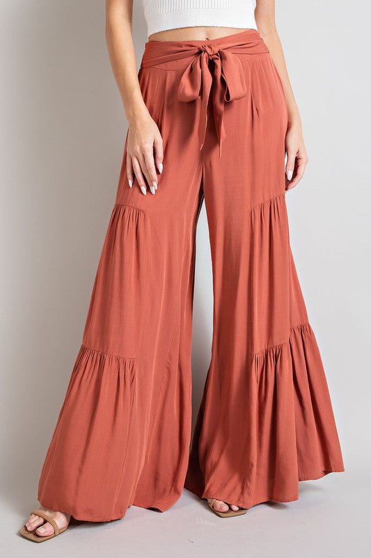 Tiered Wide leg pants made of rayon in orange with multiple colors available.