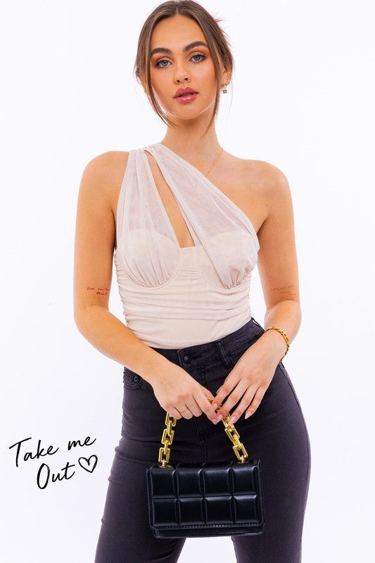 Model with brown hair wearing black jeans and the one shoulder detail mesh bodysuit with ruching against a white backdrop.