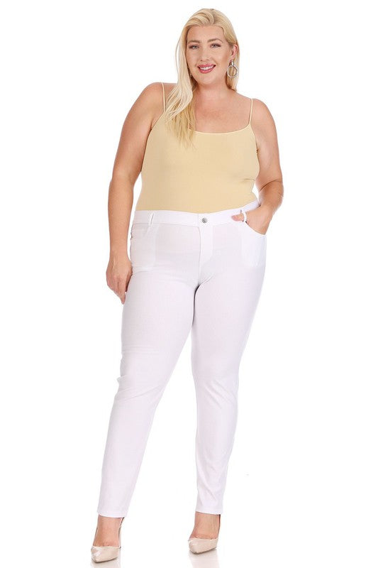 Stretchy and comfortable jeggings in white, worn by a blonde model with a tan cami top.