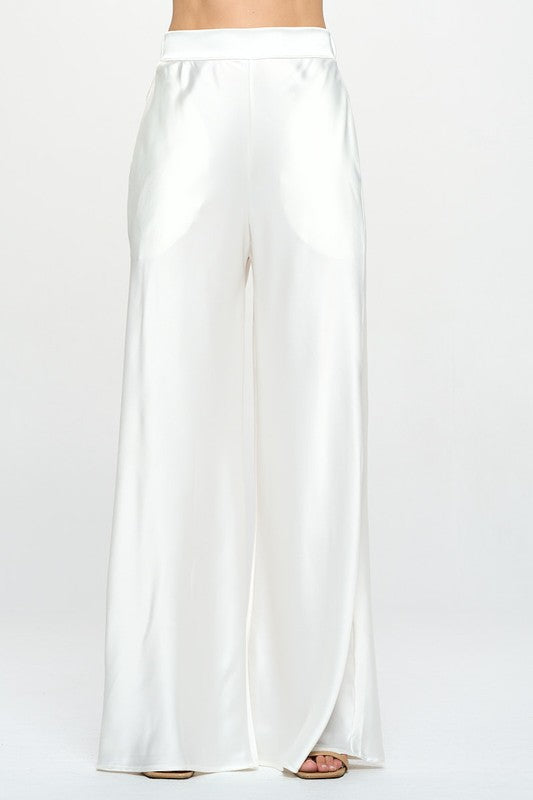 White satin dressy pants with wide leg and elastic waist.