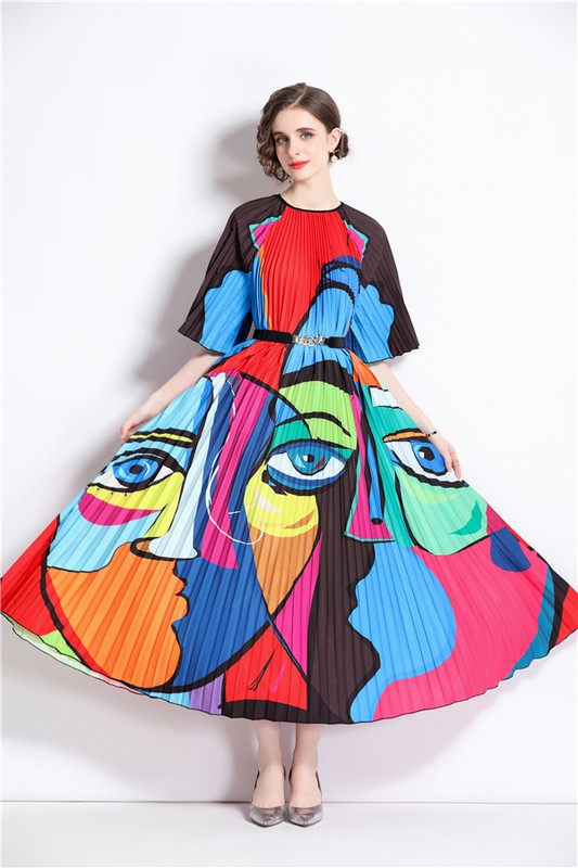 Brunette model wearing a Picasso-inspired pleated midi dress in bright multicolor. This dress is one size fits all and accommodates standard and plus sizes.