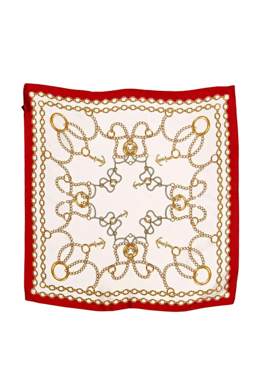 Circle and chain pattered scarf with a bold red border.