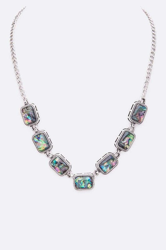 Stunning vintage inspired abalone necklace set in silver metal.