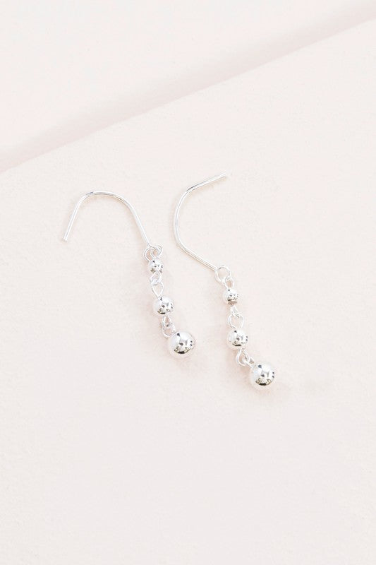 Sterling silver hook drop earrings with three graduated sterling silver balls on a hook.
