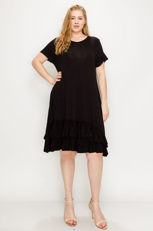 Strawberry blonde model wearing a plus size rayon mini dress with short sleeves and a double ruffle hem.
