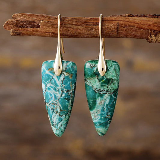 Green natural stone earrings in a triangle shape with gold hooks.