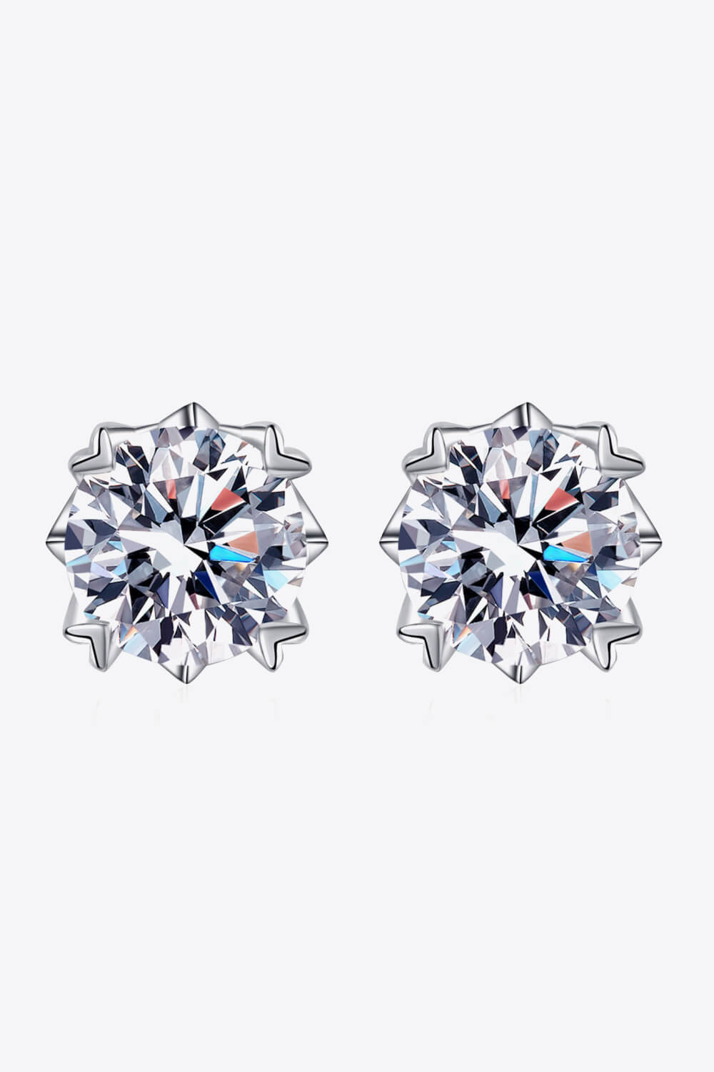 2 carat each Moissanite earrings set in sterling silver on a white background