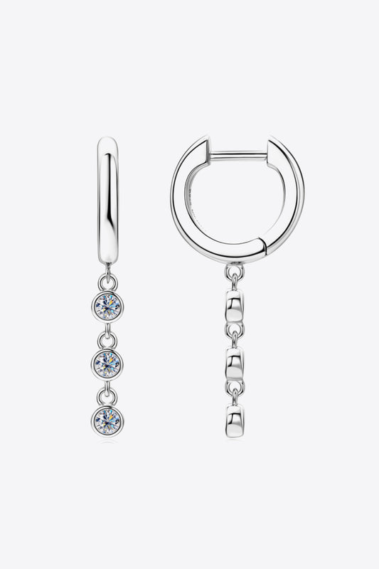 Small sterling silver hoop earrings with chain of three links and Moissanite stones on a white background