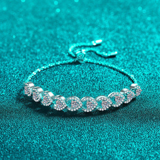 The Adrienne bracelet is set in sterling silver and has one carat of moissanite spread over 10 eye-shaped accents. Bracelet has an adjustable closure.