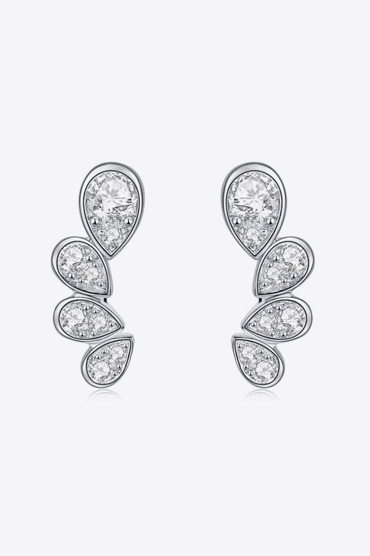 Pair of platinum-plated sterling silver earrings in pear shapes, four tall, on a white background with small moissanite stones.