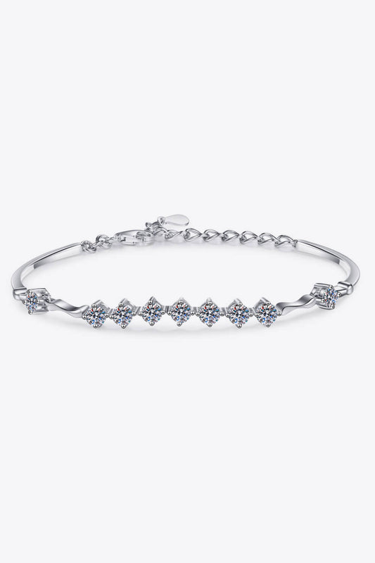 Adjustable size 1 carat Moissanite bracelet with 9 small Moissanite stones in Rhodium plated sterling silver on a white background.