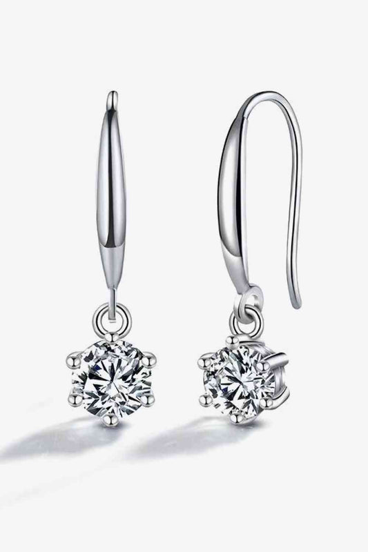 6 prong 2 carat moissanite drop earrings against a white backdrop.